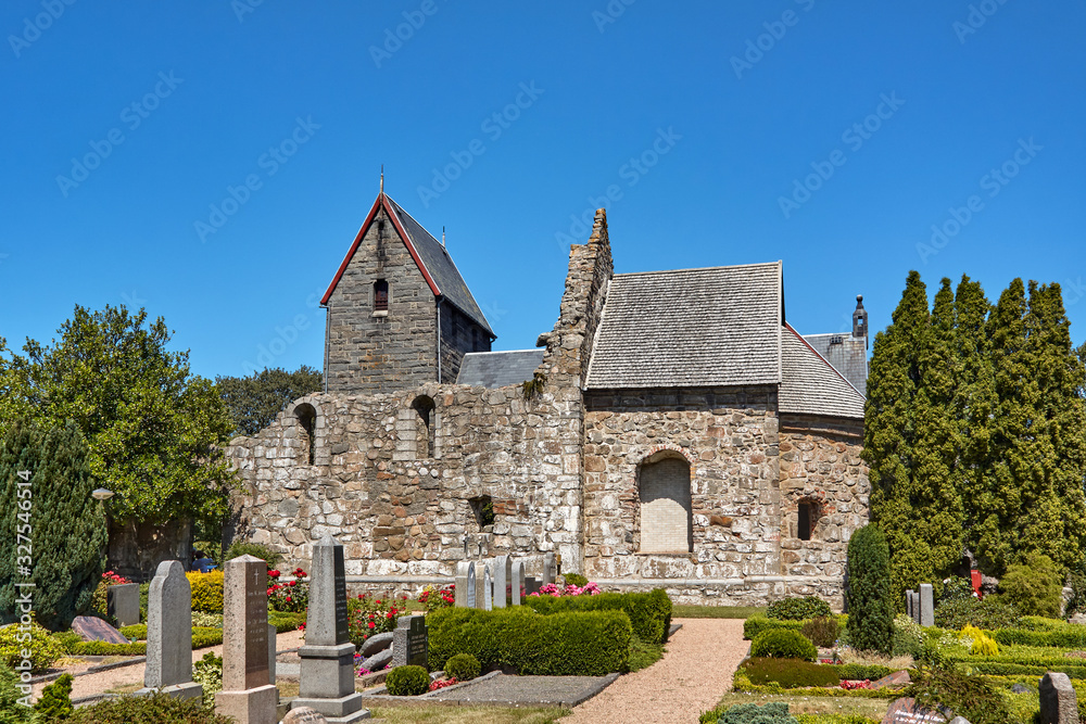 Old Ostermarie Church demolished in 1890 (foreground) and Romanesque style Ostermarie Church from 1891 (background) in Ostermarie village, Bornholm island, Denmark