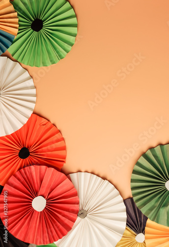 multicolored paper background. Origami in the Chinese style. Decor for the photo zone. Copy space.