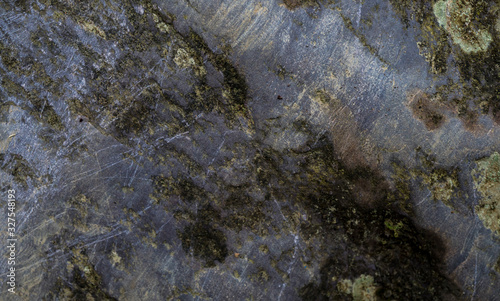 Texture of wet stone covered with moss. Background image of macro photography texture stone