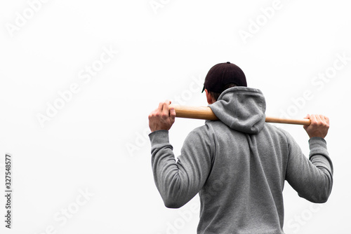 Photography Back view of man holding baseball bat on shoulders