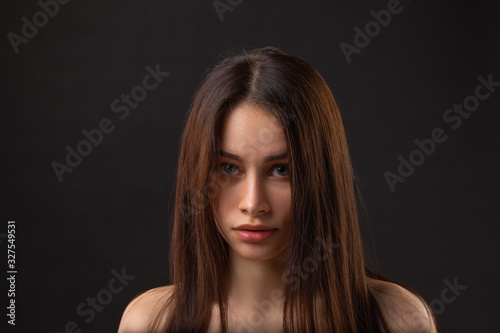 Fashion photo of beauty brunette woman on dark background