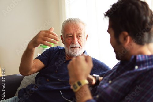 Father and son talking and sharing discussion lifestyle for domestic life at home.