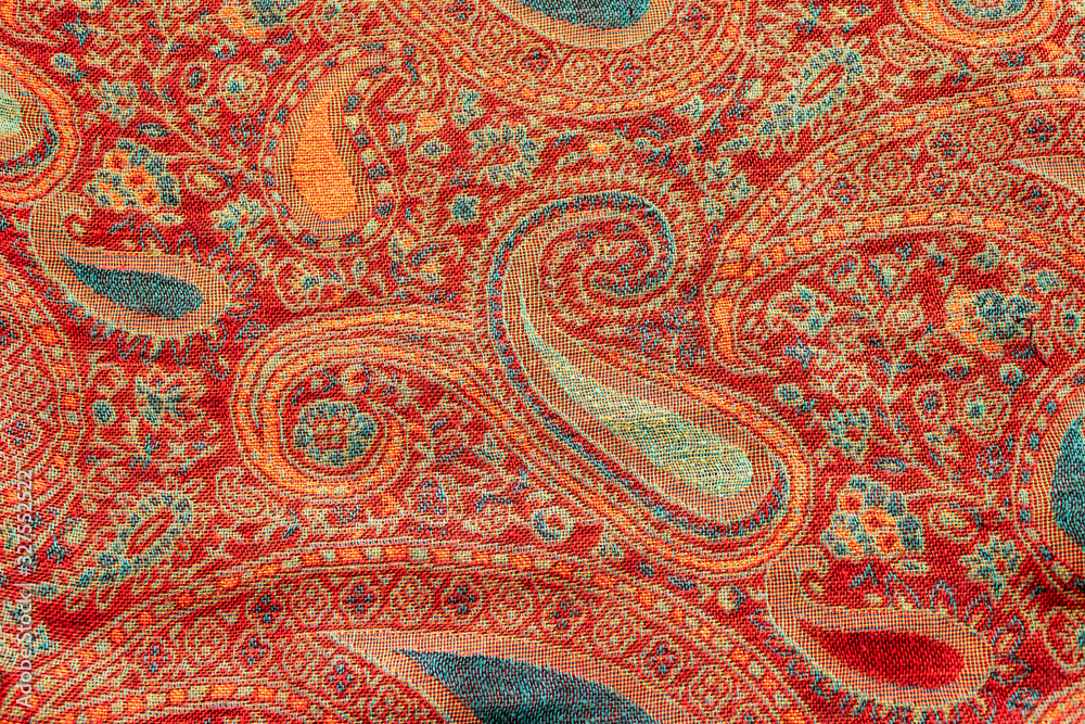 Indian floral paisley pattern with stylized blue and red flowers, closeup. Design for textile, cover, backdrop, fabric Indian floral paisley pattern with stylized blue and red flowers, closeup. Design for textile, cover, backdrop, fabric