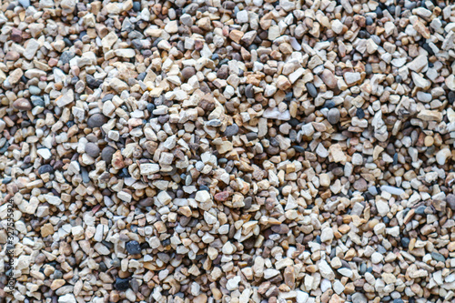 dry small river gravel with beautiful and colorful texture for gardening and pathways decorative construction by close up view