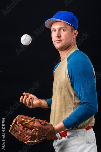 Side view of baseball player playing with ball