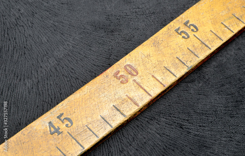 wooden ruler on fabric background