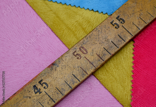 wooden ruler on fabric background