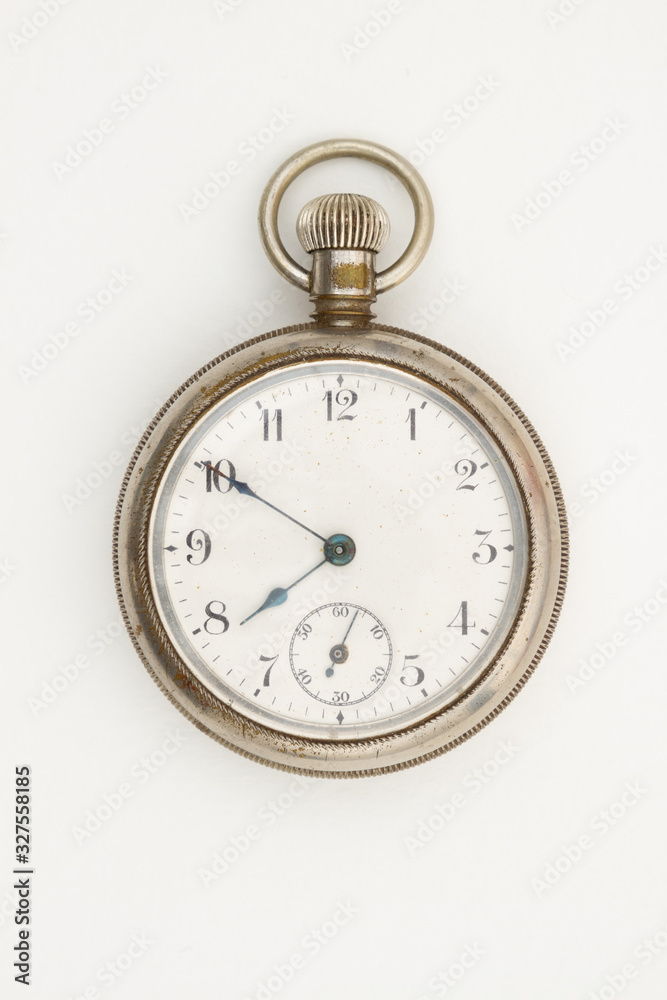 Silver pocket watch that is old and worn Silver pocket watch that is old and worn