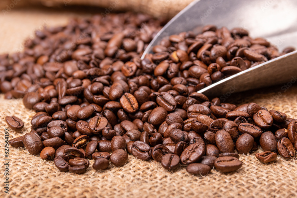 fresh Coffee beans and an old scoop