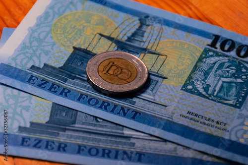 A close-up shot of Hungarian national currency (forint) banknotes and a 100 forint coin photo