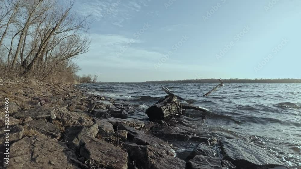 landscape waves on the river a view of the stones and white foam in bright sunlight landscape waves on the river a view of the stones and white foam in bright sunlight
