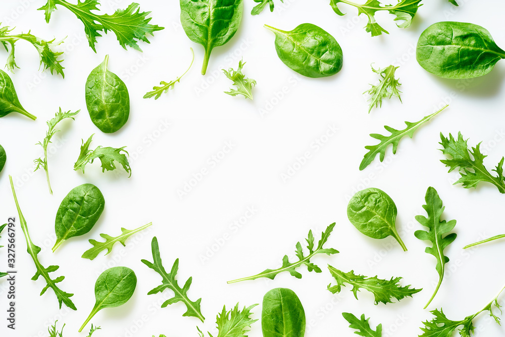 Colourful salad flat design on white background with copy space. Romaine, arugula, spinach and mizuna leaves flatlay. Vegan meal ingredients Colourful salad flat design on white background with copy space. Romaine, arugula, spinach and mizuna leaves flatlay. Vegan meal ingredients