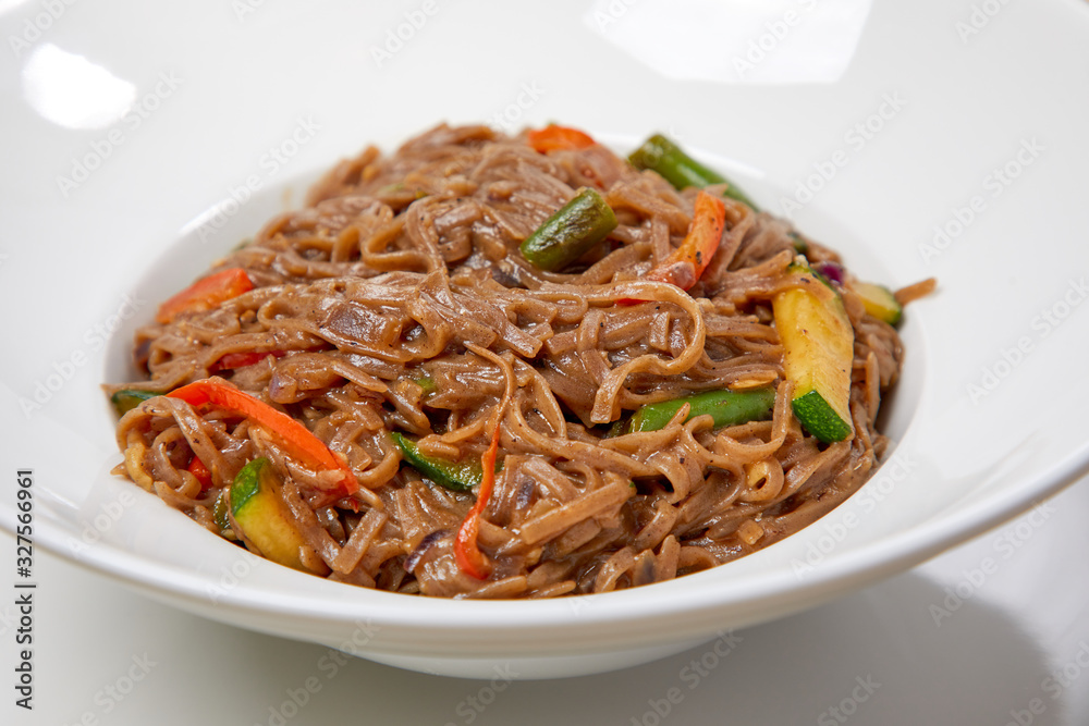 noodle with vegetables on the wooden background noodle with vegetables on the wooden background