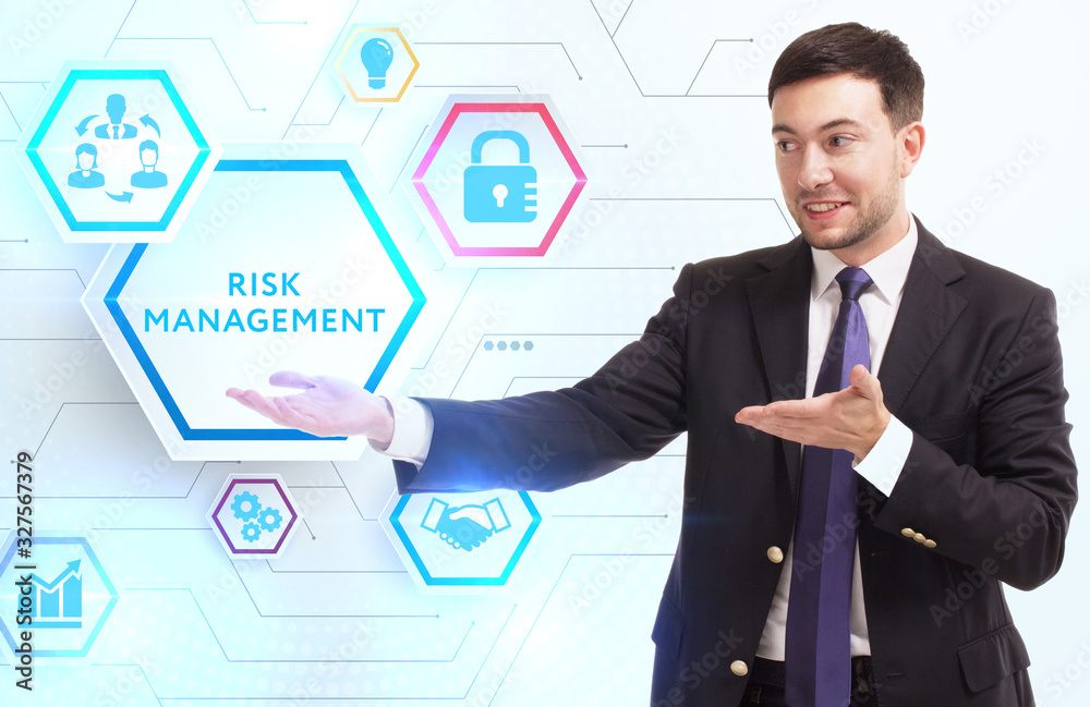 Business, Technology, Internet and network concept. Young businessman working on a virtual screen of the future and sees the inscription: Risk management Business, Technology, Internet and network concept. Young businessman working on a virtual screen of the future and sees the inscription: Risk management