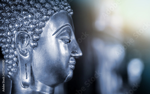 The background of the Buddha is energetic, mysterious and beautiful. Some Buddha images that emerge from darkness and light. Leave space for placing characters.