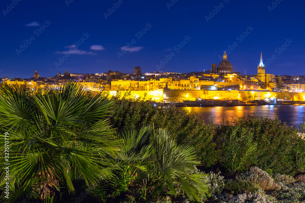 Coastline of Malta and the architecture of Valletta city at night