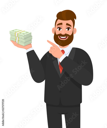 Young businessman holding cash, money or currency notes in hand and pointing finger. Trendy person showing bunch of banknotes or dollar. Male character illustration, financial in vector cartoon style.