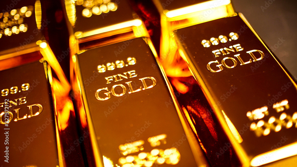 Many gold bullions brighting on the table. Many gold bullions brighting on the table.
