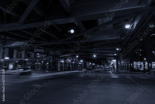 Chicago, night traffic between bridges and skyscrapers