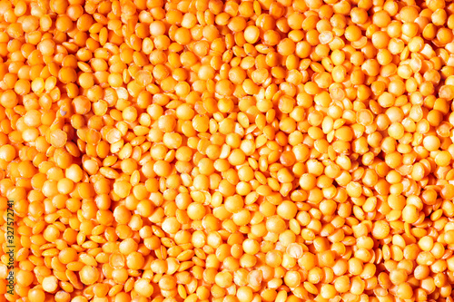 Close up red lentil seeds background. Healthy vegeterian food. Texture. photo