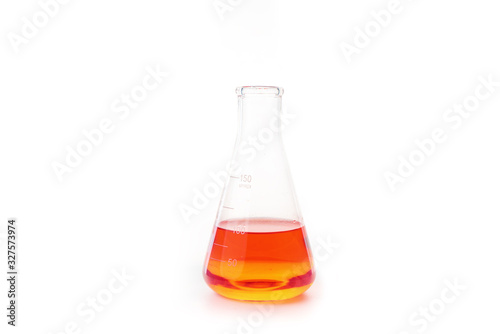 Orange liquid in glass beaker