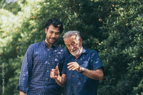 The old man and his son are...