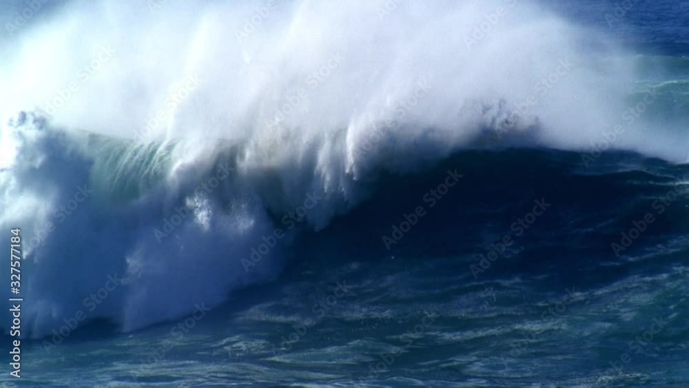 Large heavy wave breaking onto a shallow reef. Power of the nature
