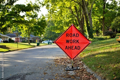 road work ahead construction sign in a residential neighborhood