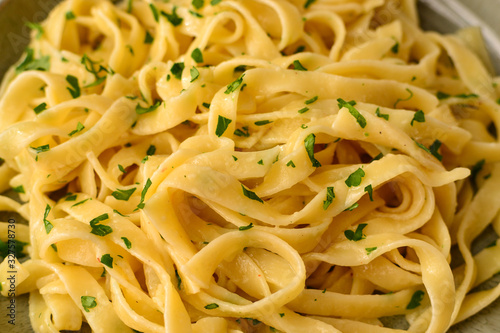 Italian pasta fettuccini. Pasta with cream and parsley  close-up.