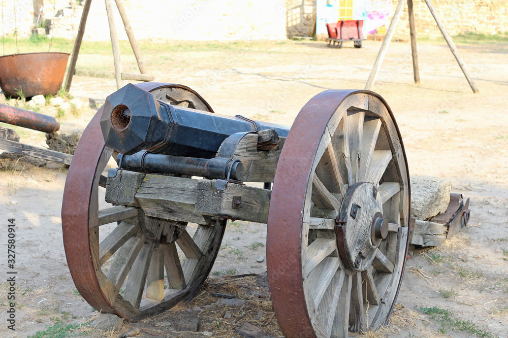 An old cannon on wheels