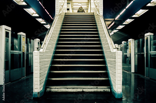Принти на полотні Man at the top of stairways in metro station in Paris