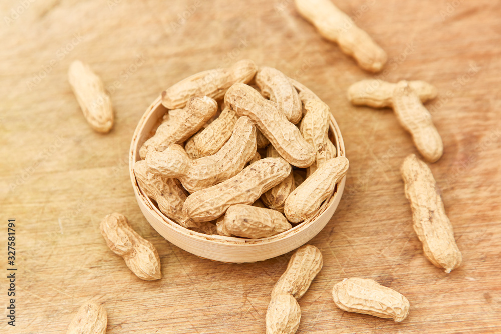 A pile of peanuts in a bamboo basket A pile of peanuts in a bamboo basket