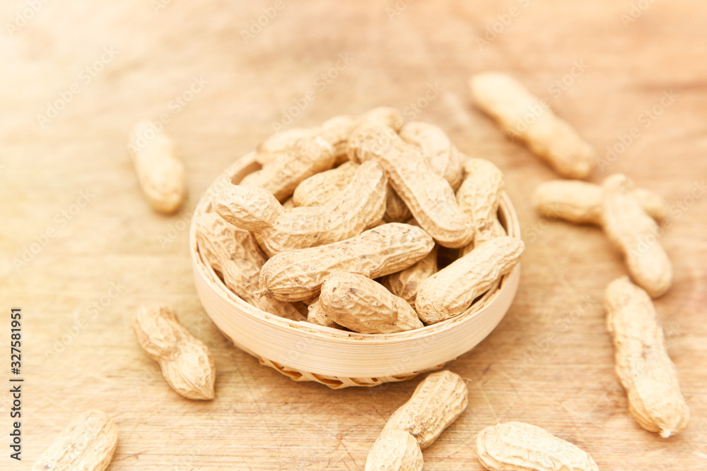 A pile of peanuts in a bamboo basket A pile of peanuts in a bamboo basket