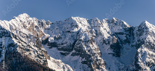 the snowy mountains of the Brembana valley, between the Italian alps, during a fantastic winter day, near the town of Branzi, Italy - February 2020.