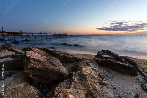 sunset on coast of sea