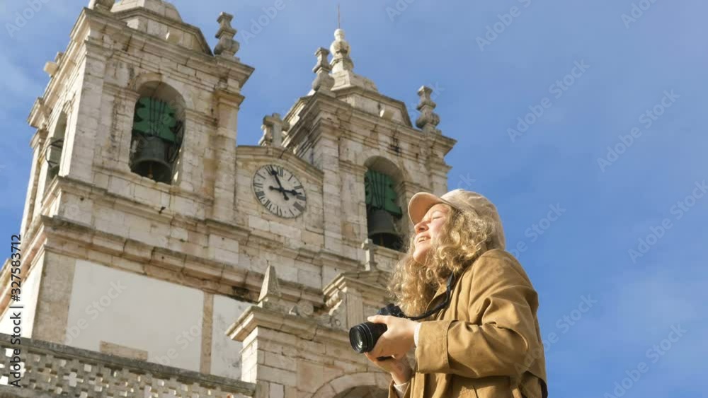 tourist takes photos of famous landmarks against building tourist takes photos of famous landmarks against building