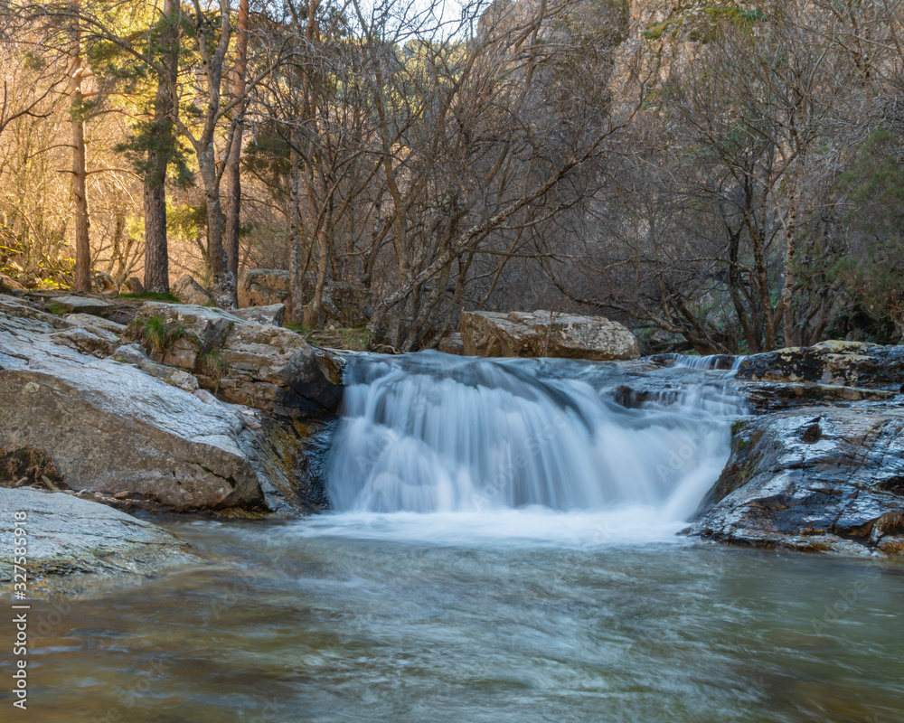 Small waterfall of cold waters coming from the thaw. Long exposition.