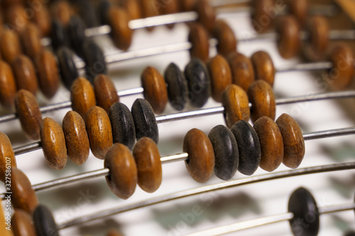 Wooden abacus on a white background.