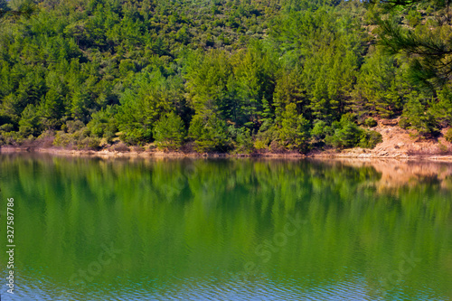 reflection of trees in lake of balaban, Turkey  photo