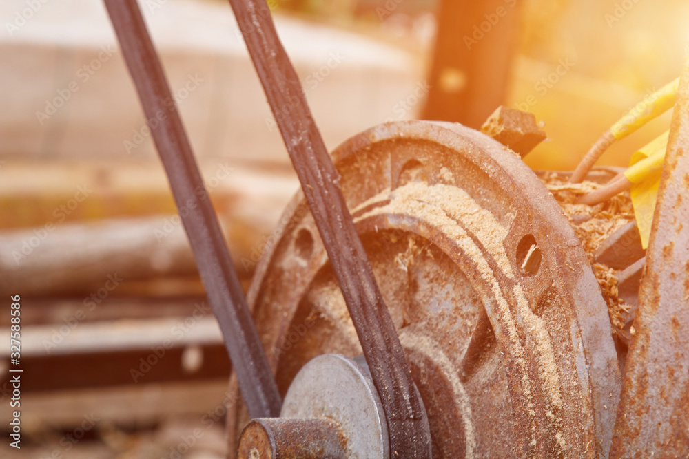 sawmill disks in a woodworking machine at a factory or a sawmill. mechanism. a lot of sawdust. sawmill disks in a woodworking machine at a factory or a sawmill. mechanism. a lot of sawdust.