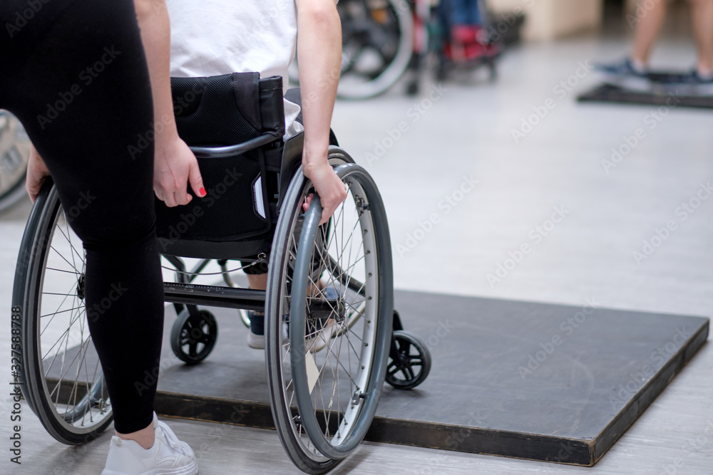 Obraz premium volunteer help for active rehabilitation of disabled people, rehabilitation of people with disabilities