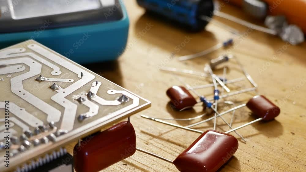 Soldering of electronic circuit board with electronic components. Engineers repair circuit board. Soldering of electronic circuit board with electronic components. Engineers repair circuit board.