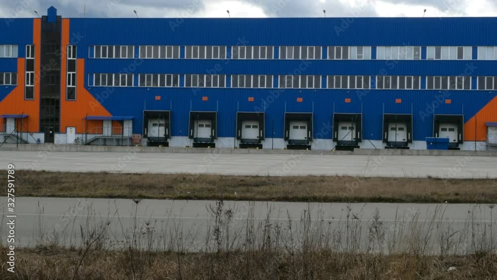 Loading dock on warehouse. modern logistics center. docking stations of a distribution center with gates for loads and trucks. Loading dock on warehouse. modern logistics center. docking stations of a distribution center with gates for loads and trucks.