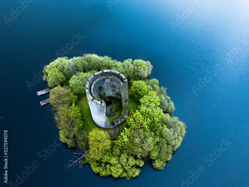Drone aerial image of Cloughoughter Castle which is a ruined circular castle on a small island in Lough Oughter, 4 kilometres east of the town of Killeshandra in County Cavan, Ireland.