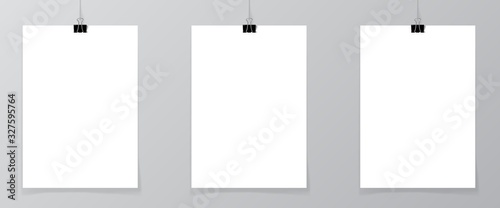 Set of 3 blank posters hanging on thread with clips