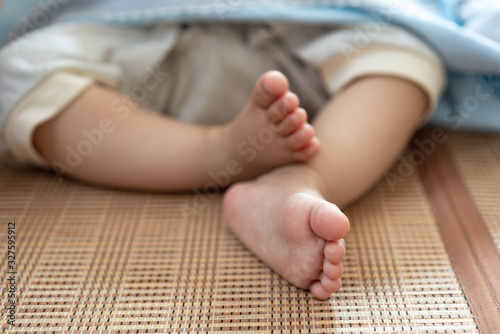 Close up of sleeping baby's feet © Allen Chen