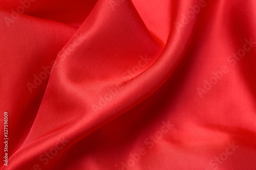 expensive fabric texture. abstract background with soft waves. Smooth elegant red silk or satin luxury cloth