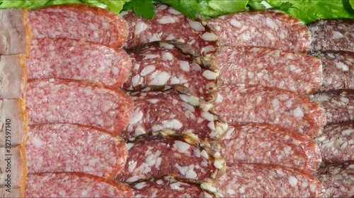 sausage slicing with herbs close up
