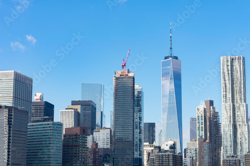 Lower Manhattan New York City Skyline Scene with Modern Skyscrapers on a Clear Blue Day © James