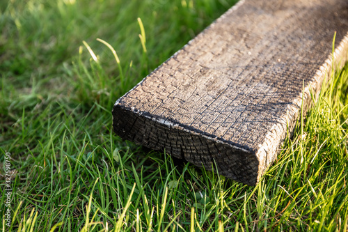 Pine board is burned as a method of processing from beetles. Aged decorative board. Facing material. photo